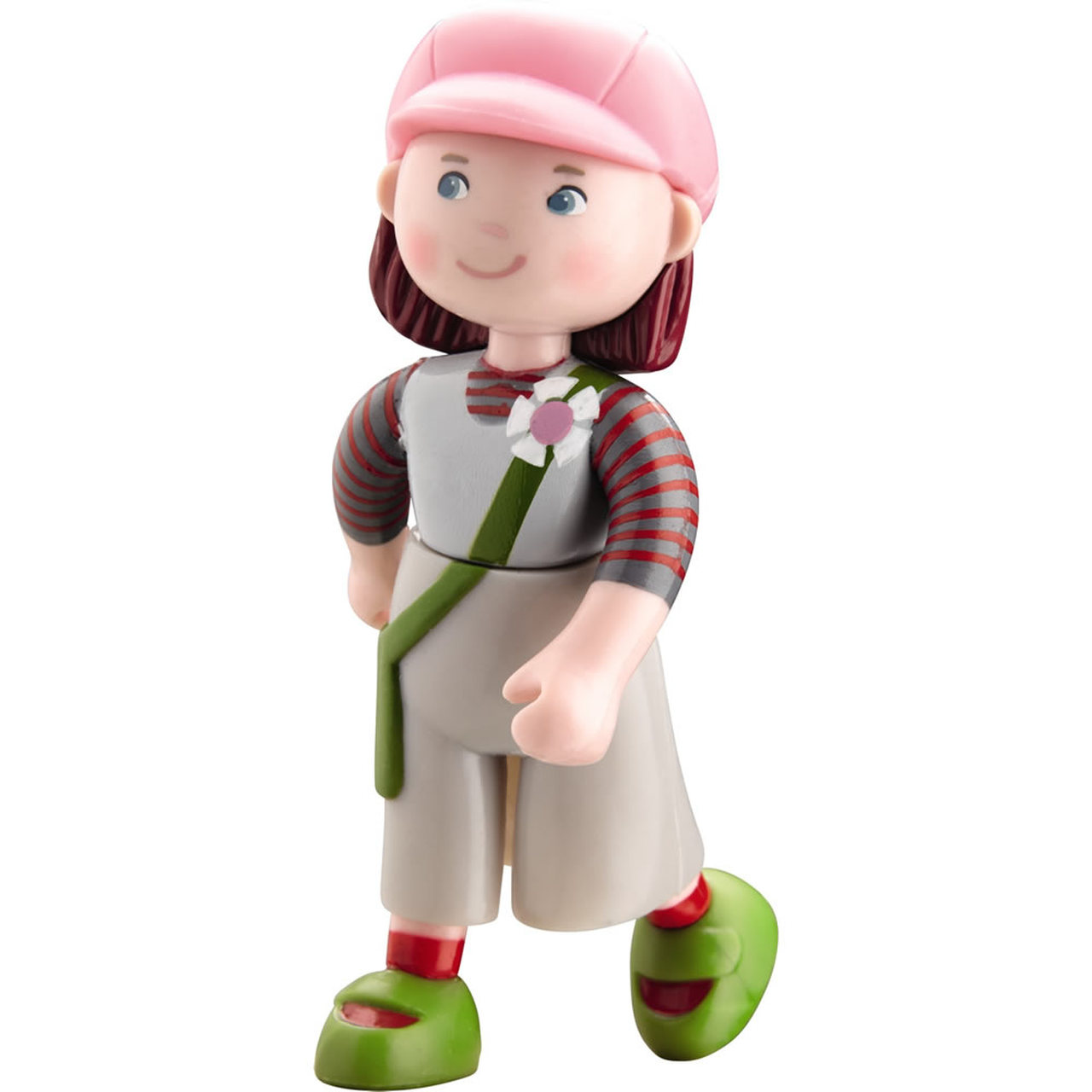 Small plastic doll of a white girl in a pink and green outfit